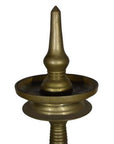 Close-up of an antique-style brass incense burner with a pointed top, set against a plain white background.