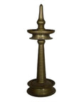 Close-up of a brass incense burner with spiral design and pointed top, inspired by antique Indian ceremonial lamps.