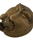 Close-up of a solid brass box with a traditional monkey's head design, showing intricate detailing and open mouth.