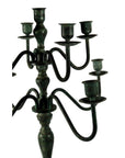 Bronze vintage candelabra with five candle holders and ornate curved arms, lost wax cast, on white background.