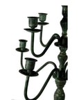 Close-up of vintage bronze candelabra with five empty holders, lost wax cast, on a white background.