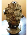 Bronze Guardian Lion lamp base with ornate carvings, multiple lions facing out, close-up from above.