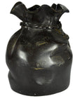 Shiny black ceramic vase with twisted rim, close-up view, suitable for tabletop or use as paperweight.
