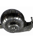 Bronze snail sculpture with a detailed shell and textured body, shown as a desktop paperweight.