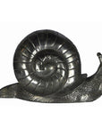 Bronze snail sculpture with detailed spiral shell, close-up, shown as a desktop paperweight.