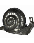 Close-up of a bronze snail sculpture with silver tone, used as a desktop paperweight.