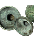 Greenish-bronze oxidized bronze urns with wide, shallow openings, close-up view, both in very good condition.