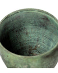 Close-up of a bronze urn with a weathered greenish finish and rough, aged texture in very good condition.