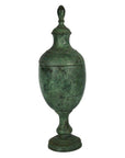Bronze antique-style urn with lid and pedestal base, close-up view showing classical design, very good condition.