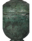 Close-up of a green patina bronze urn with textured surface and rounded lid, lost wax cast.