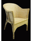 Light tan rattan chair with curved back and woven detail, close-up against a black background.