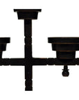 Close-up of a black metal candle holder with three arms and minimalist geometric design on white background.