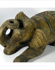 Close-up of hand-carved wooden elephant figurine with intricate patterns and raised trunk, very good condition.