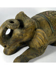 Close-up of hand-carved wooden elephant figurine with intricate patterns and raised trunk, very good condition.