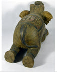 Painted wood elephant with carved patterns, belly-down, rear view, in good condition.