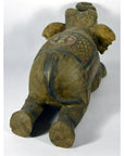 Painted wood elephant with carved patterns, belly-down, rear view, in good condition.