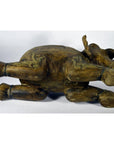 Brown wood elephant sculpture with intricate carvings, lying on its side, shown in good condition.