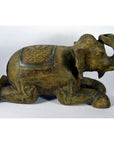 Bronze elephant statue with ornate carvings and blanket, kneeling, in good condition.