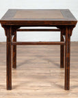 Brown elmwood hall table with Ming Dynasty stone inset, 19th-century Chinese, on wooden floor.