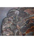 Close-up of 19th century Chinese rosewood lacquered wall plaque with hand-carved bird and foliage details.