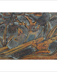 Close-up of a hand-carved Chinese 19th c. rosewood lacquered wall plaque with birds and foliage design.