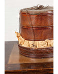 Brown wood Chinese tiered food basket with lid and string tie, 19th-century, on a wooden surface.