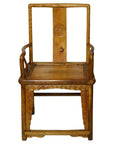 Brown Yumu wood chair with square back, hand-carved medallion, Greek key pattern, and decorative carvings.