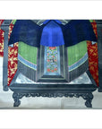 Colorful linen canvas Chinese ancestors painting with gold leaf, red floral drapes, displayed on altar indoors.