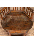 Brown bamboo Chinese antique child's corner chair with hexagonal base on wood floor.