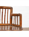 Close-up of brown bamboo Chinese antique child's corner chair with hexagonal base, polished finish.