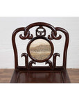 Dark rosewood Chinese side chair with open fretwork backrest and round marble medallion featuring landscape design.