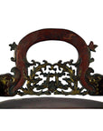 Dark red and gold bamboo wedding basket with intricate floral and bird carvings, close-up view.