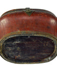 Red-brown oval bamboo basket with metal trim, worn and darkened bottom, wedding style, wood material.