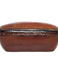 Brown rectangular antique Chinese basket with domed lid, ornate black and gold edge detailing, close-up view.