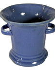 Close-up of Chinese blue celadon porcelain planter with two side handles and a wide, flared rim.