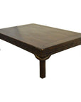 Dark wood Chinese coffee table with rectangular top, carved friezes, and four short legs on white background.