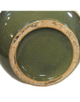Close-up of base of Chinese crackle celadon porcelain vase, showing crackled glaze and lightly worn unglazed rim.