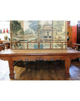 Dark wood Chinese daybed with carved legs, styled with Asian decor and a scenic Shanxi folding screen backdrop.