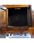 Brown Chinese elm wood apothecary cabinet with double doors and carved details, accommodates 24" sink, good condition.