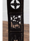 Dark patina elmwood chair with dragon and floral carvings, inspired by 19th century Chinese design, indoor setting.