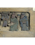 Brown wood hand-carved Chinese plaque, two figures with fans, partial figures on the left, close-up view.