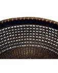 Close-up of natural woven cane Chinese lacquered bamboo basket with geometric lattice pattern on white background.