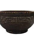 Dark brown lacquered bamboo basket with wide opening and textured, patterned sides, close-up view.
