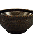 Close-up of a round, dark brown lacquered bamboo basket with wide opening and textured woven sides.