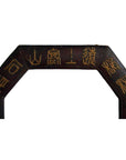 Close-up of vintage dark wood octagonal leather frame with gold Chinese calligraphy on upper section.