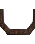 Close-up of a dark brown leather octagonal frame with gold calligraphy on its surface.