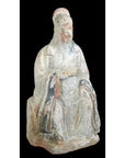 Terracotta Ming Dynasty court figure statuette in faded robes, partially eroded face, 17th century, close-up.