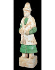 Terracotta Ming Dynasty court figure in hat and robe with green sleeves, on rectangular base, close-up.