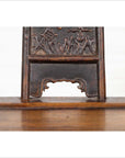 Close-up of ornately carved elmwood panel, dark brown wood, from Chinese Ming Dynasty chair.