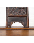 Close-up of ornately carved elmwood panel, dark brown wood, from Chinese Ming Dynasty chair.